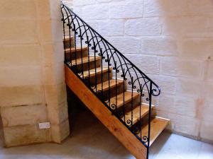 wrought iron black staircase with wooden frame  - General Metal Works Malta