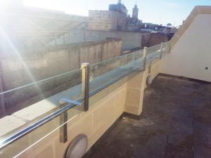 Stainless steel hand railing with glass effect - General Metal Works Malta